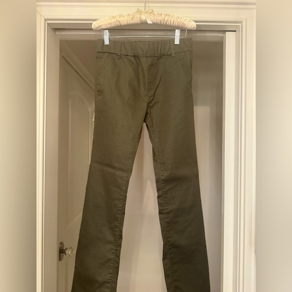 Flog Olive Green with thin black threading pants.